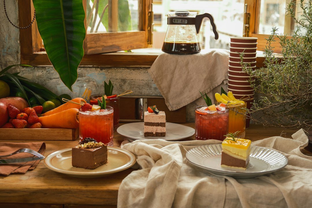 Freshly baked cakes and pastries arranged on a table.