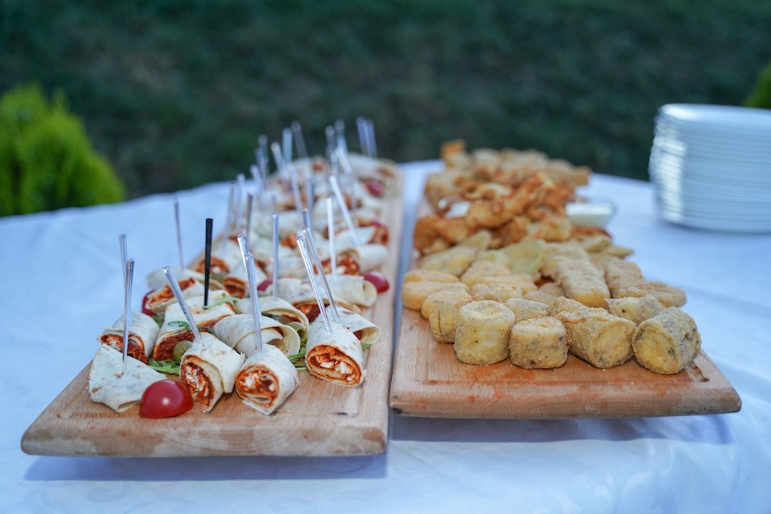 A selection of appetizers served on wooden boards.